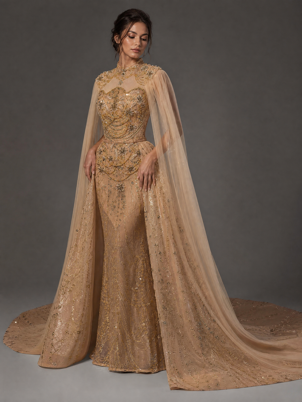 Champagne Gold Crystal Cape and Train Evening Gown — three-quarter view (SKU-001) — reviewed generated product image
